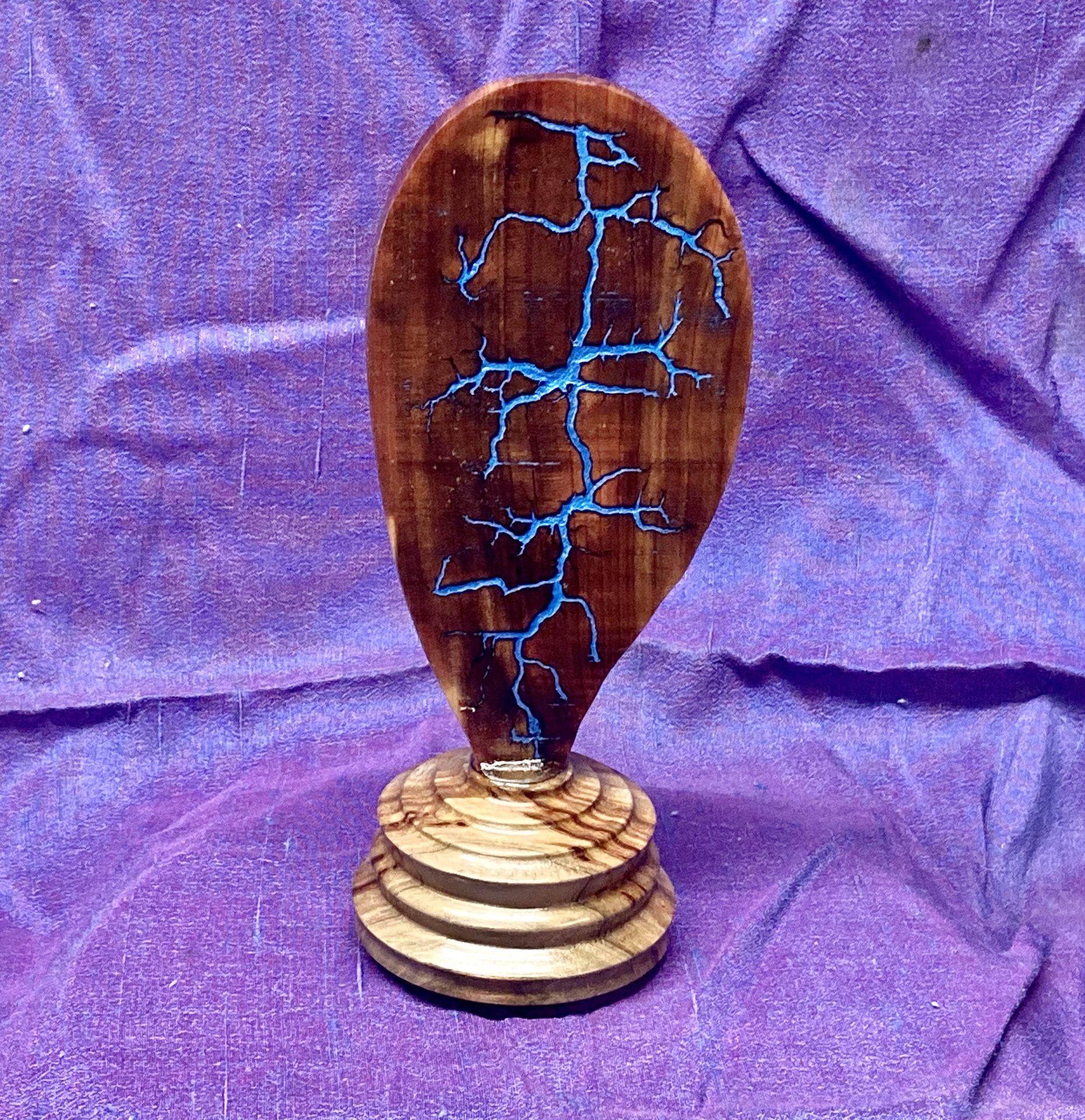 Lichtenberg burn on red cedar with blue metallic inlay on ambrosia maple base